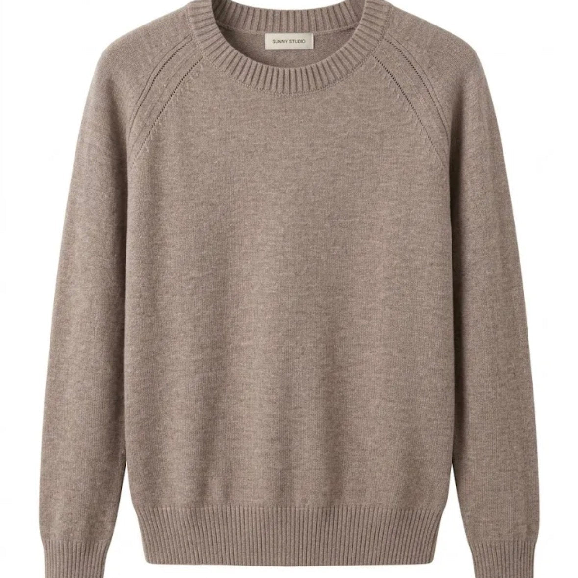 KIDDING Taupe beige knit raglan sweater with a ribbed crew neck and pointelle detail along the shoulders, displayed flat against a plain white background
