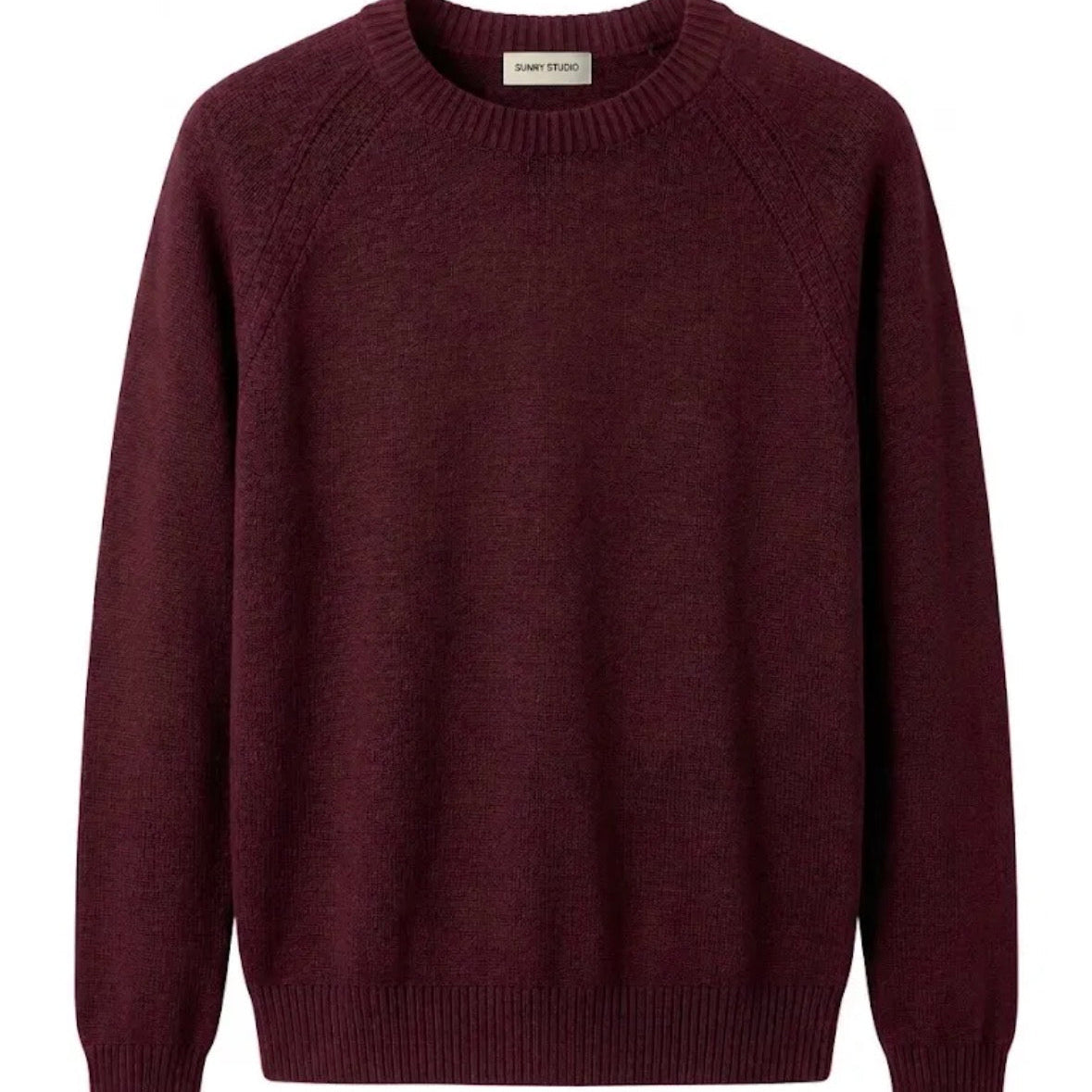 KIDDING wine knit raglan sweater with a ribbed crew neck and pointelle detail along the shoulders, displayed flat against a plain white background