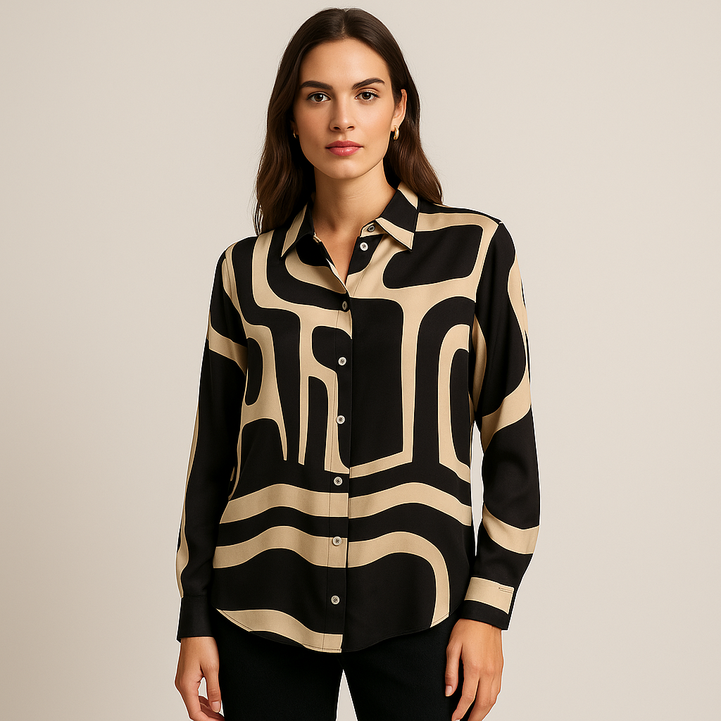 Woman wearing a black and beige patterned shirt against a plain background