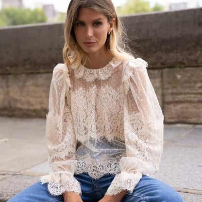Model wearing KIDDING off-white sheer plumeti mesh blouse with scalloped eyelash lace overlays and high collar"